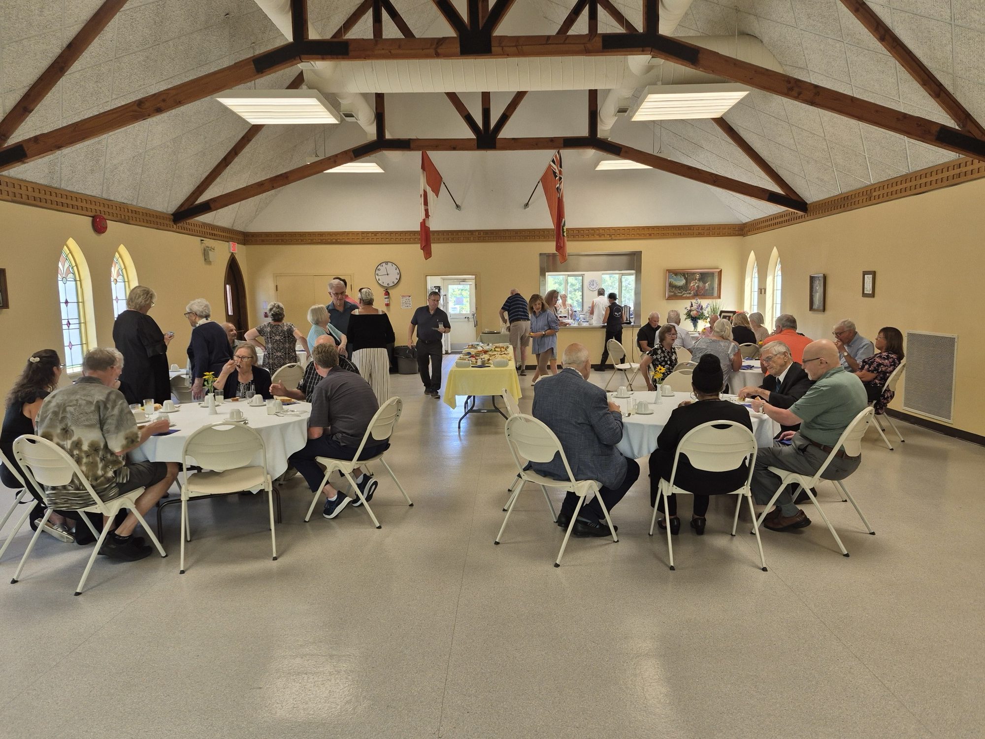 Epiphany parishioners gathered around tables in the church hall.
